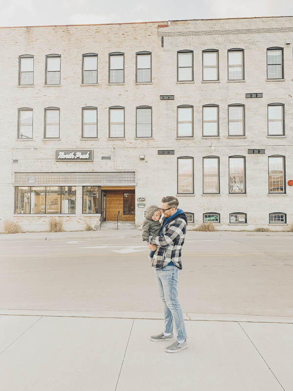 Man holding baby in Traverse City Michigan at North Peak