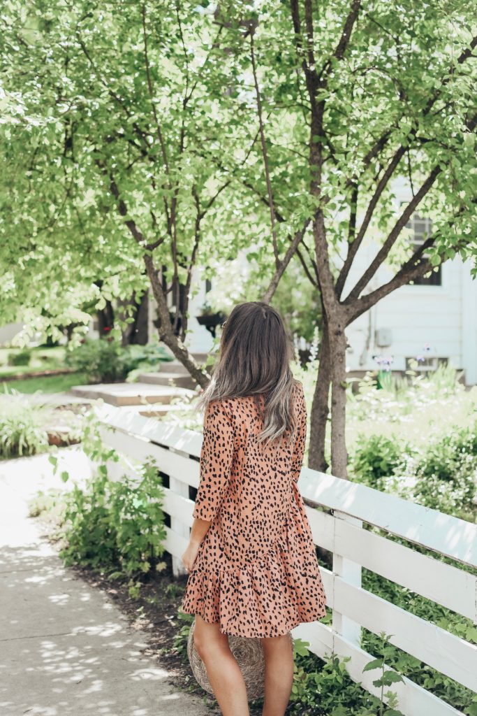 Girl in pink dress in neighborhood