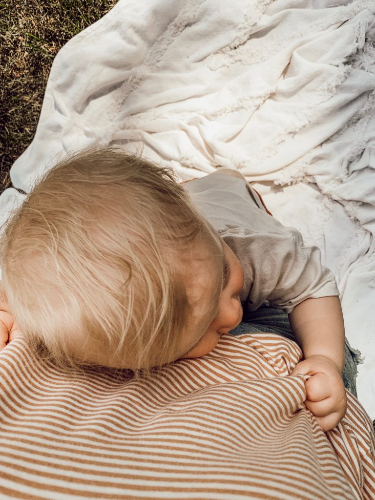 Baby hugging mom