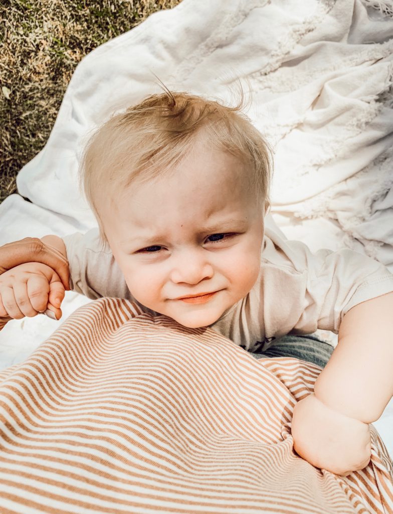 Baby looking up at mom